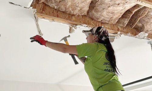 A JM Clean Care cleaning technician works on an interior demolition project.